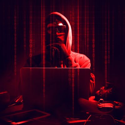 digital-composite-image-male-hacker-using-laptop-with-binary-codes-darkroom-scaled.jpg